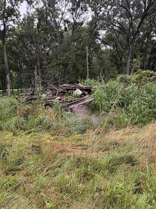Storm debris and a collapsed structure on a Central Illinois property